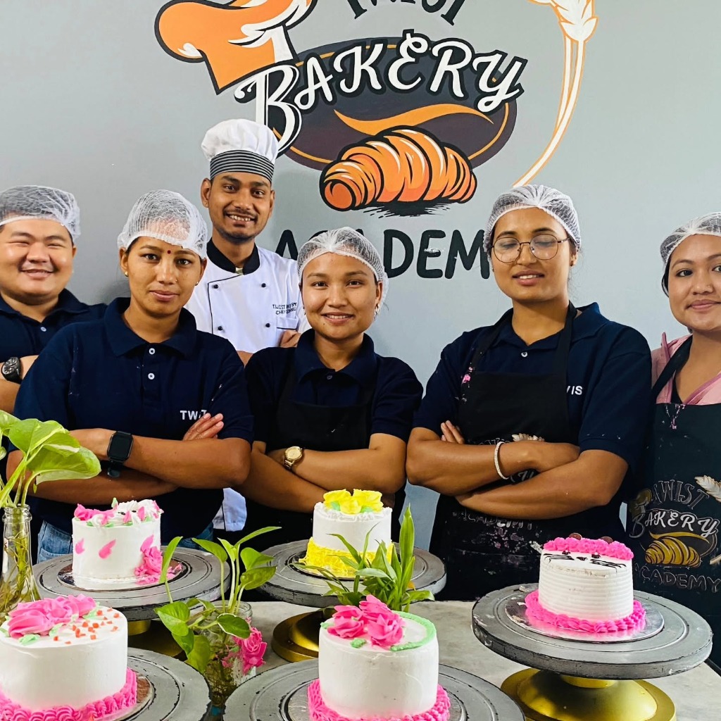 Twist Bakery students presenting their decorated cakes