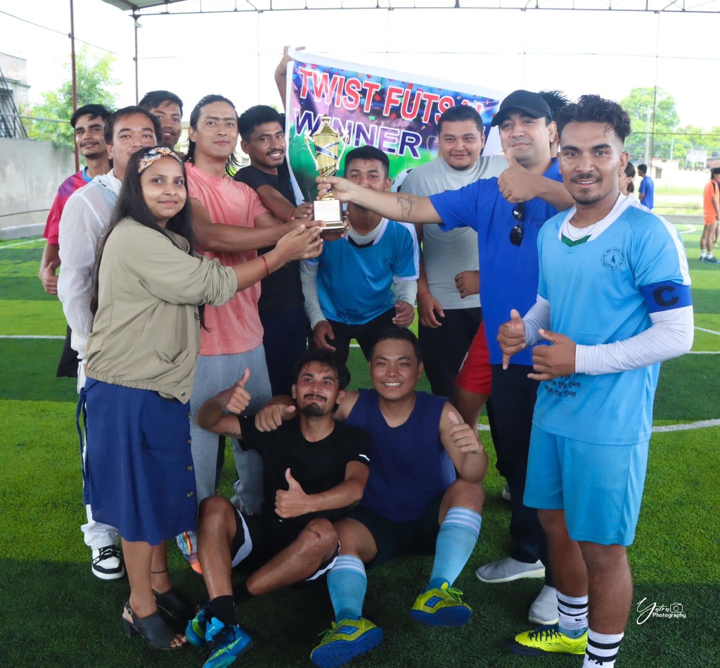 Twist Futsal Boys Winner team holding trophy and banner